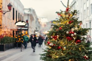 Winter holiday city streets with Christmas tree and garlands stock photo